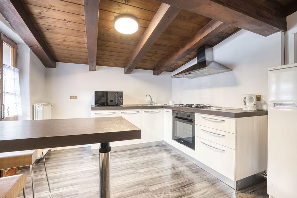 Cabinetry, Property, Furniture, Countertop, Wood, Kitchen, Interior Design, Window, Kitchen Stove, Architecture