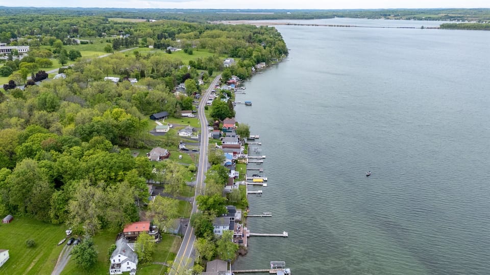 Nestled along a scenic shoreline, this cozy lakefront retreat sits in a charming and peaceful neighborhood 🌳🏘️✨
