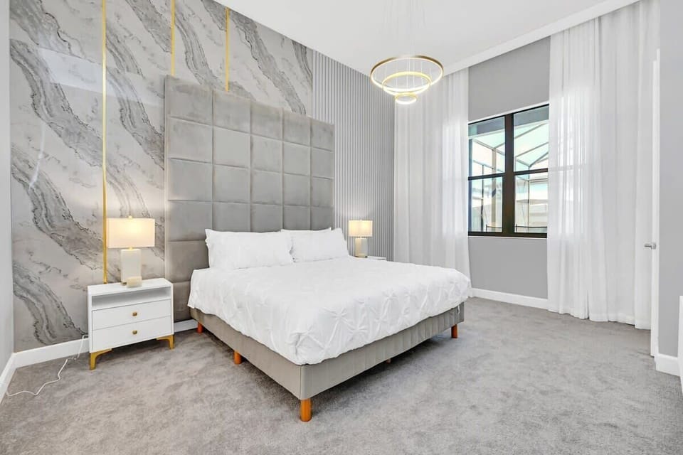 Recharge in comfort in this inviting king bedroom, complete with a plush king bed, flat-screen TV, high-speed Wi-Fi, and a relaxing atmosphere perfect for unwinding after a fun-filled day.