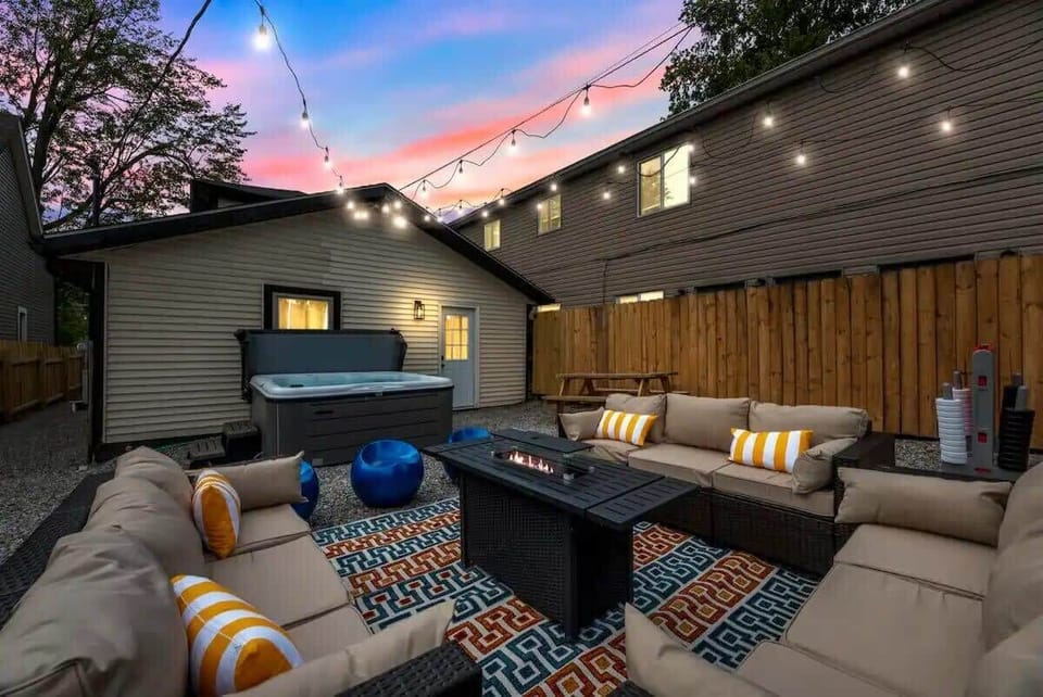 Your backyard oasis with hot tub, fire pit, games and cozy seating