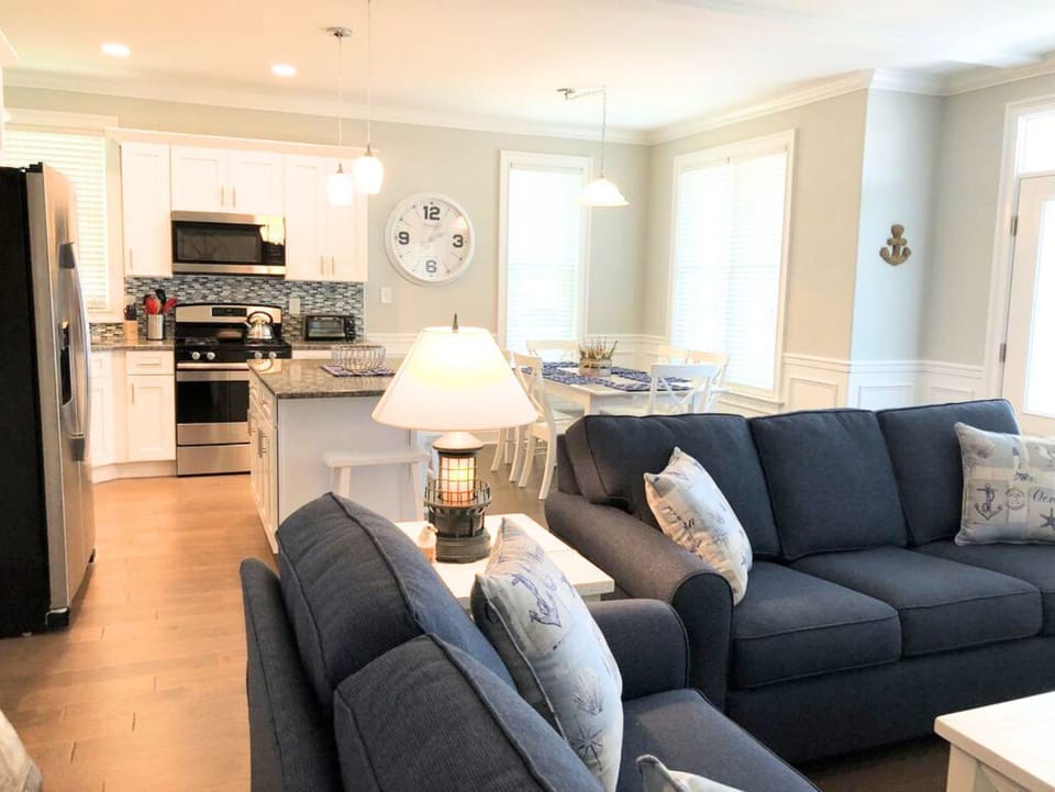 Coastal living room with nautical decor and plush seating
