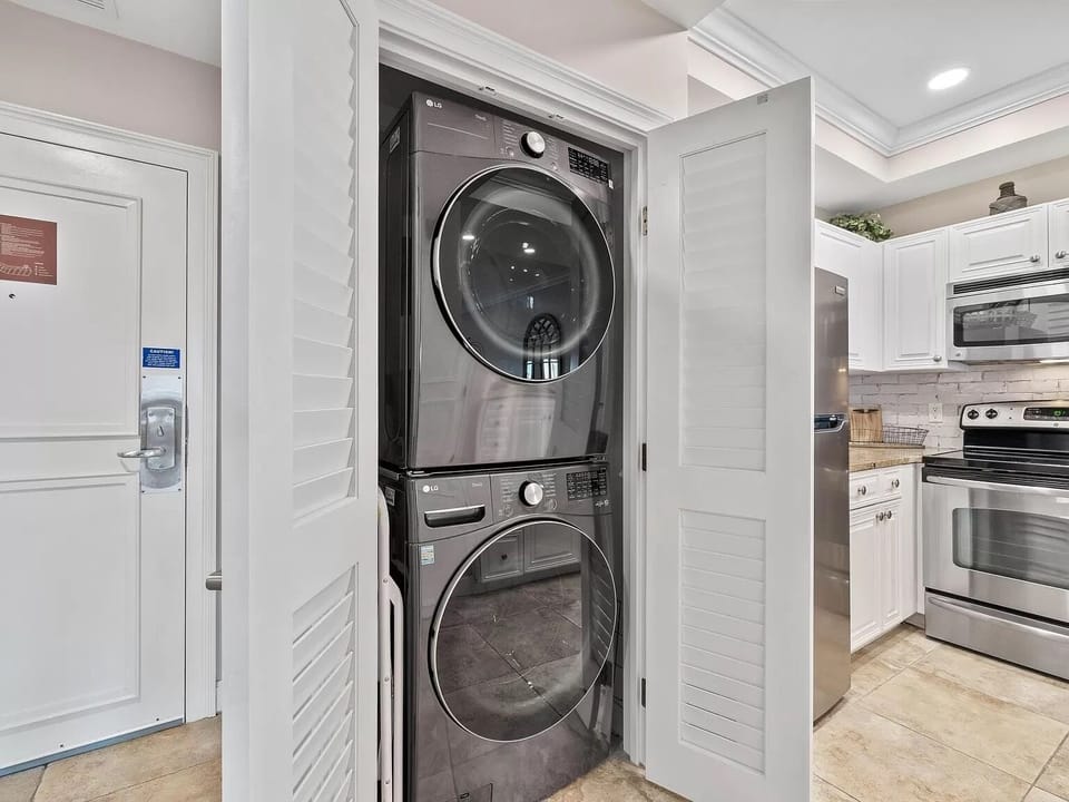 full sized washer and dryer in kitchen closet.