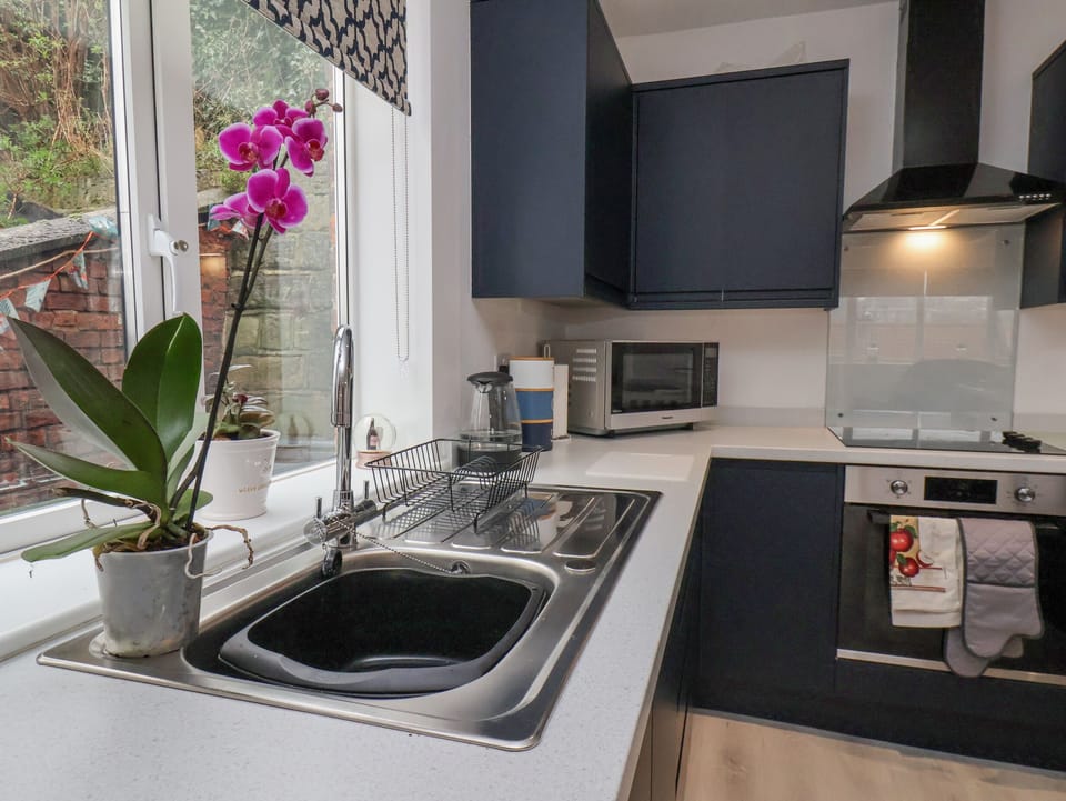 Fridge, electric kettle, cookware/dishes/utensils