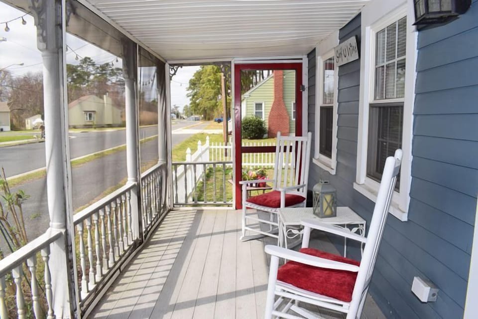 Unwind on the spacious screened porch, the perfect spot for morning coffee or evening cocktails.