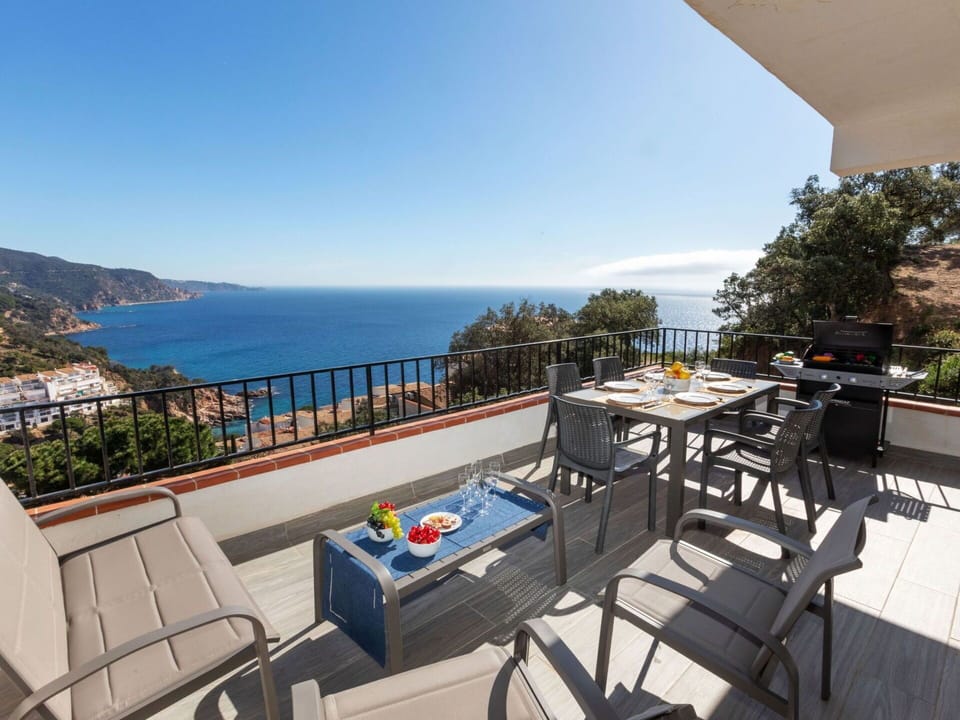 Sky, Table, Water, Furniture, Building, Flowerpot, Chair, Seaside Resort, Outdoor Furniture, Outdoor Table