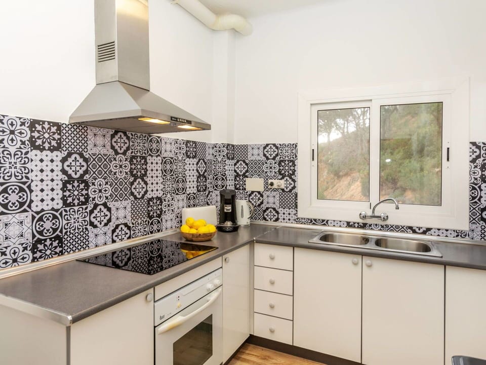 Kitchen, Flooring, Interior Design, Countertop, Kitchen Appliance, Floor, Major Appliance, Cabinetry, Home, Tile
