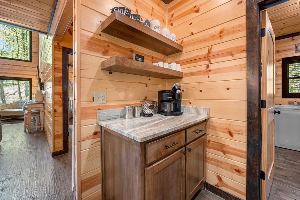 Start your mornings with the aroma of coffee in our charming nook, a little corner of cabin bliss.
