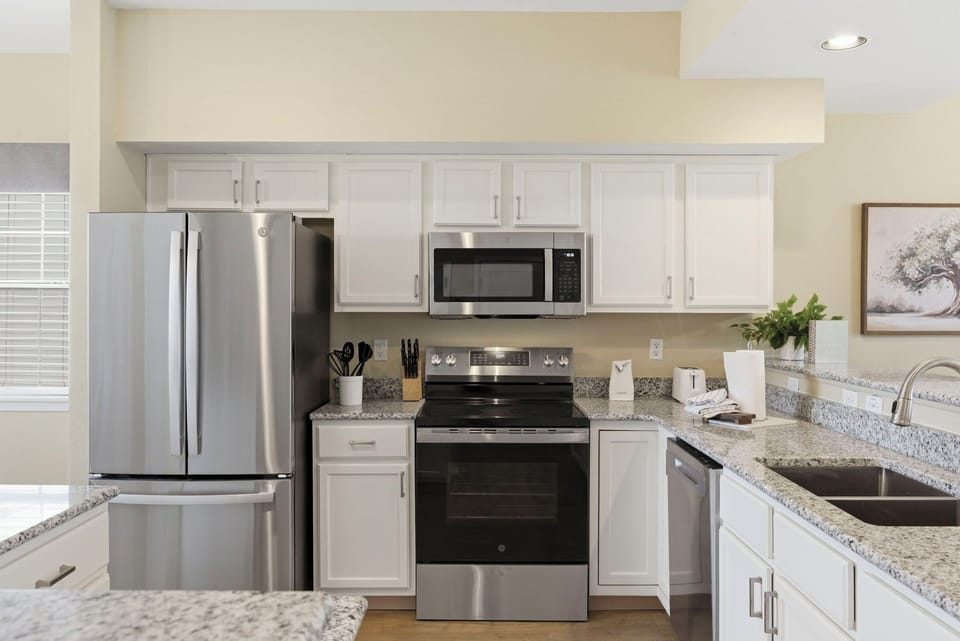 Fully equipped kitchen featuring new appliances and a recent remodel