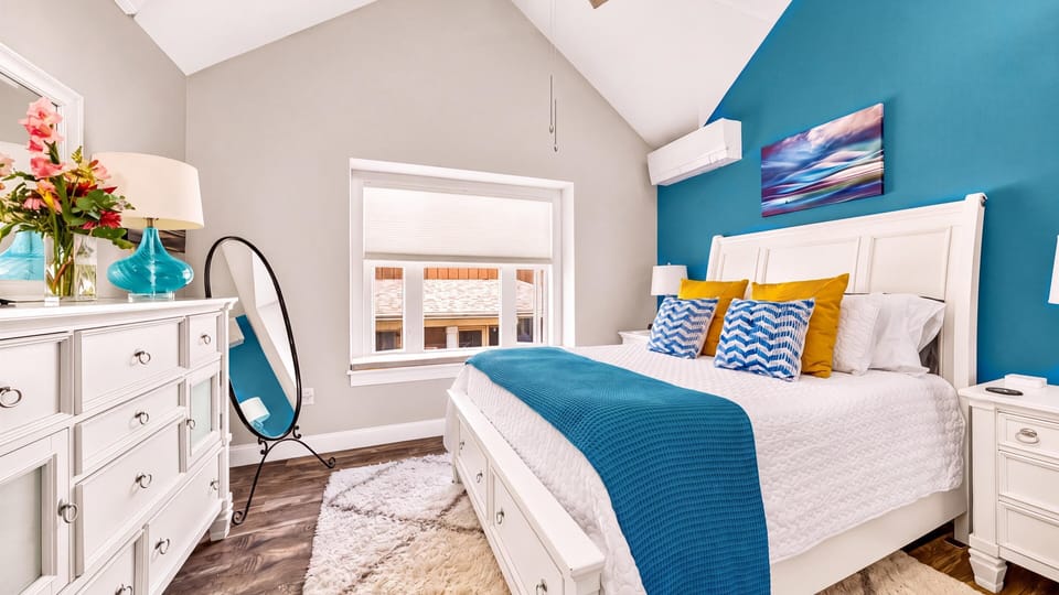 Wake up to lake views visible as you're laying in bed through this window.