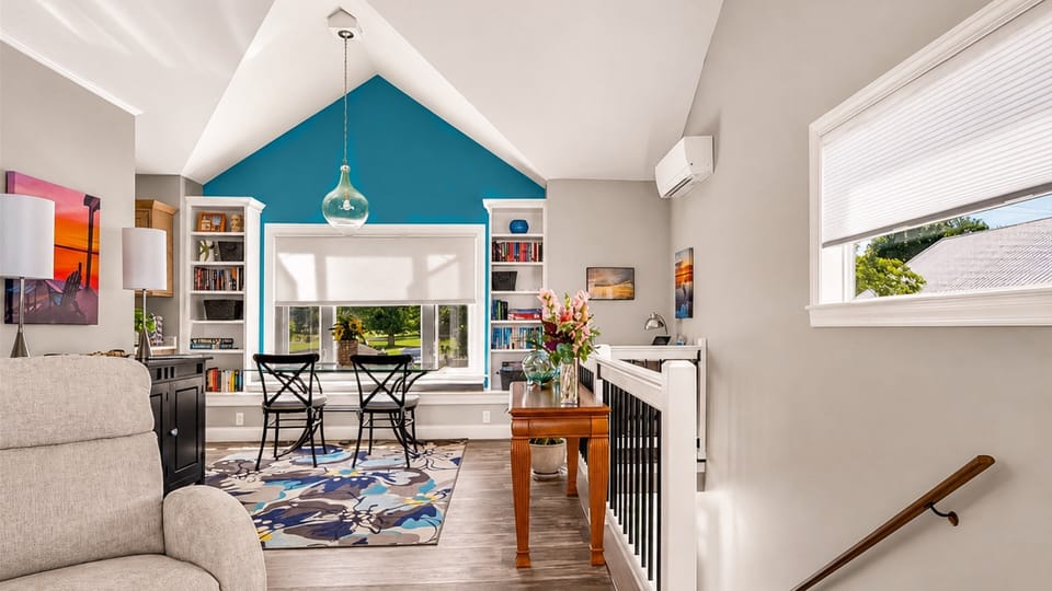 Up the stairs from the front door, the bright open living space comes to life.
