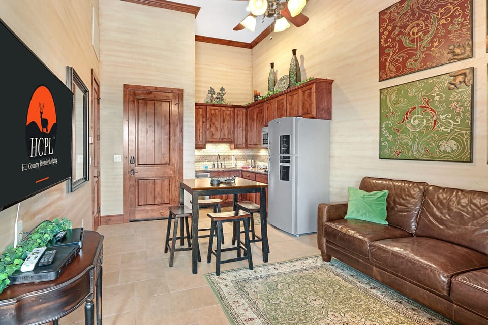 The dining area is between the living room and kitchen