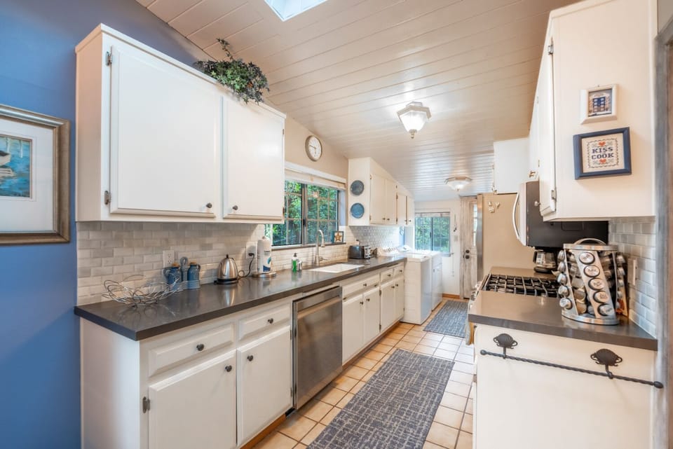Kitchen is equipped with cooking basics and appliances.