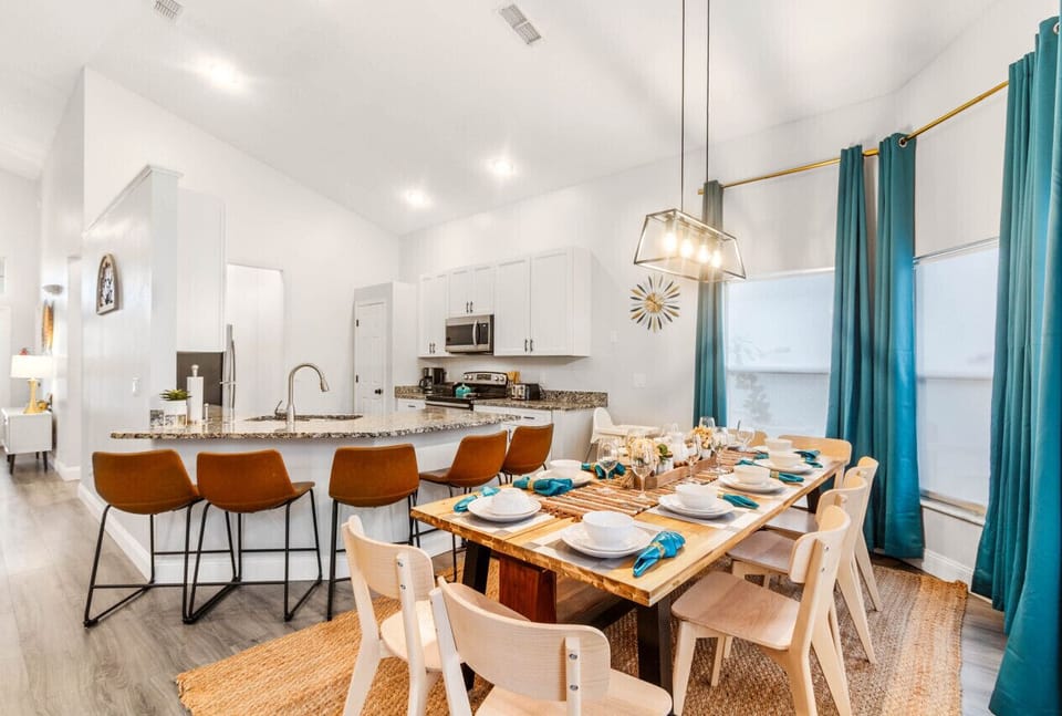 Social hub: Pull up a leather barstool at the kitchen`s stylish bar