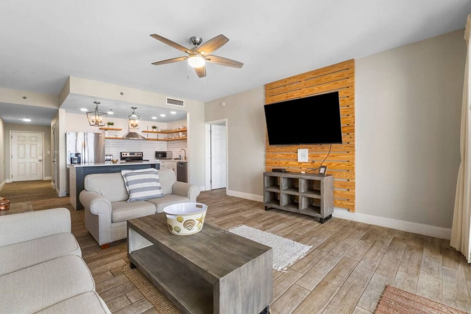 Living Area with Ocean Views, Sleeper Sofa, Large Flat Screen TV, and Private Balcony Access