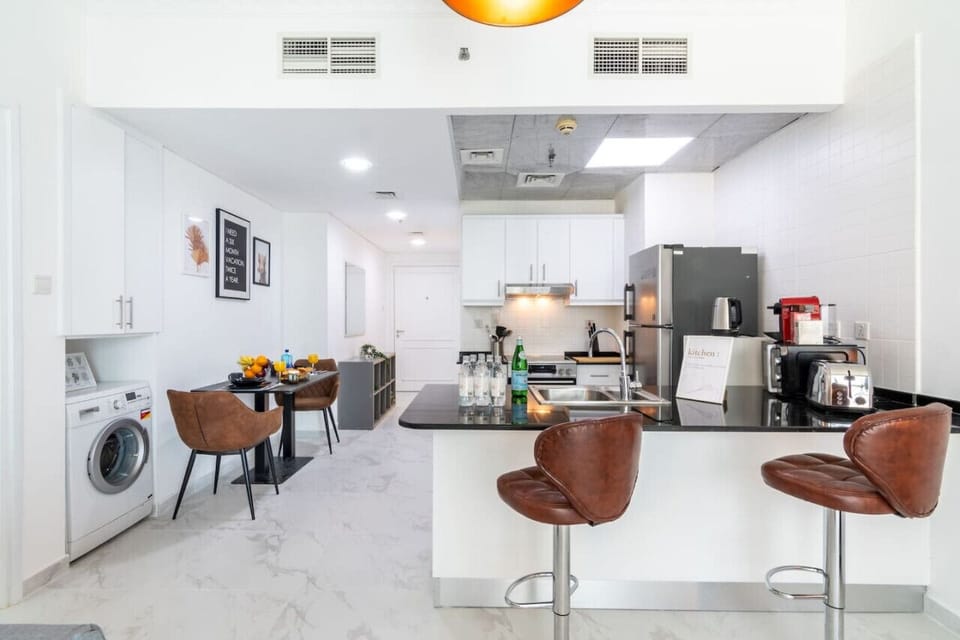 Kitchen: Modern space with sleek appliances and a chic dining area for gourmet adventures!