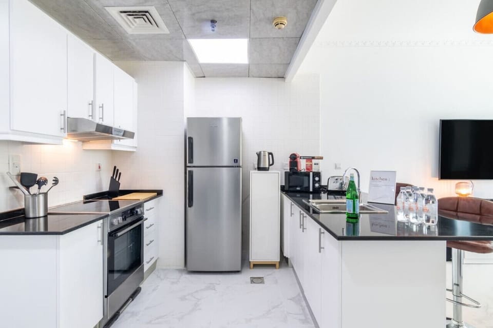 Kitchen: Sleek design with modern appliances for culinary adventures in Dubai!