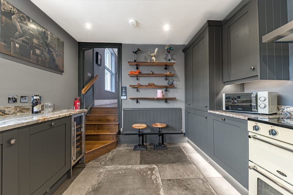 The kitchen is fitted with top of the range appliances and features beautiful granite worktops