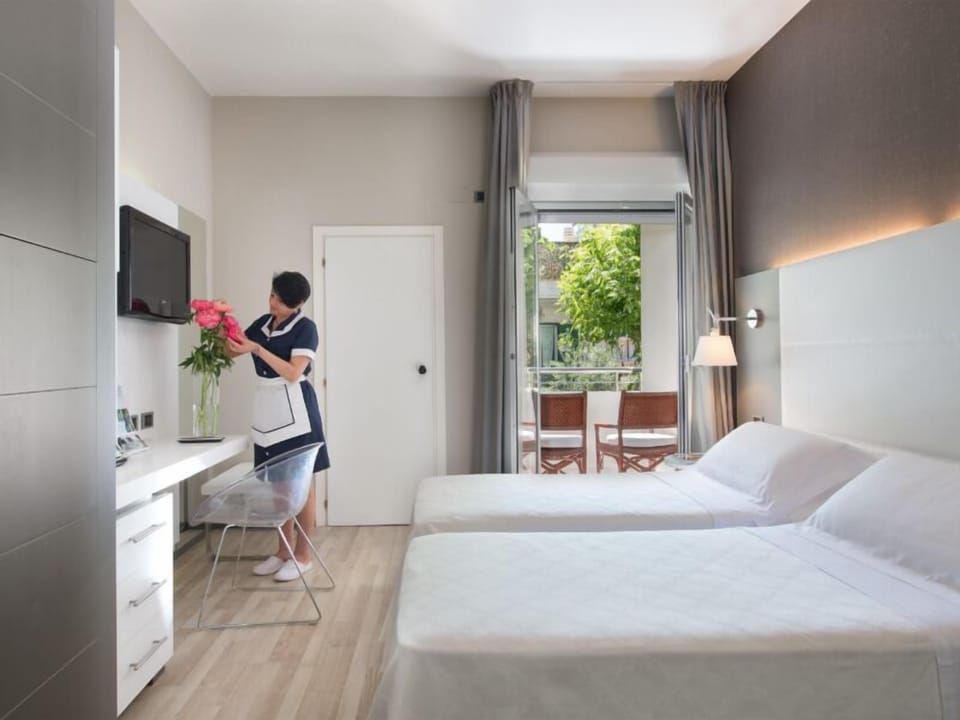 Family Room, Balcony | Down comforters, in-room safe, desk, blackout drapes