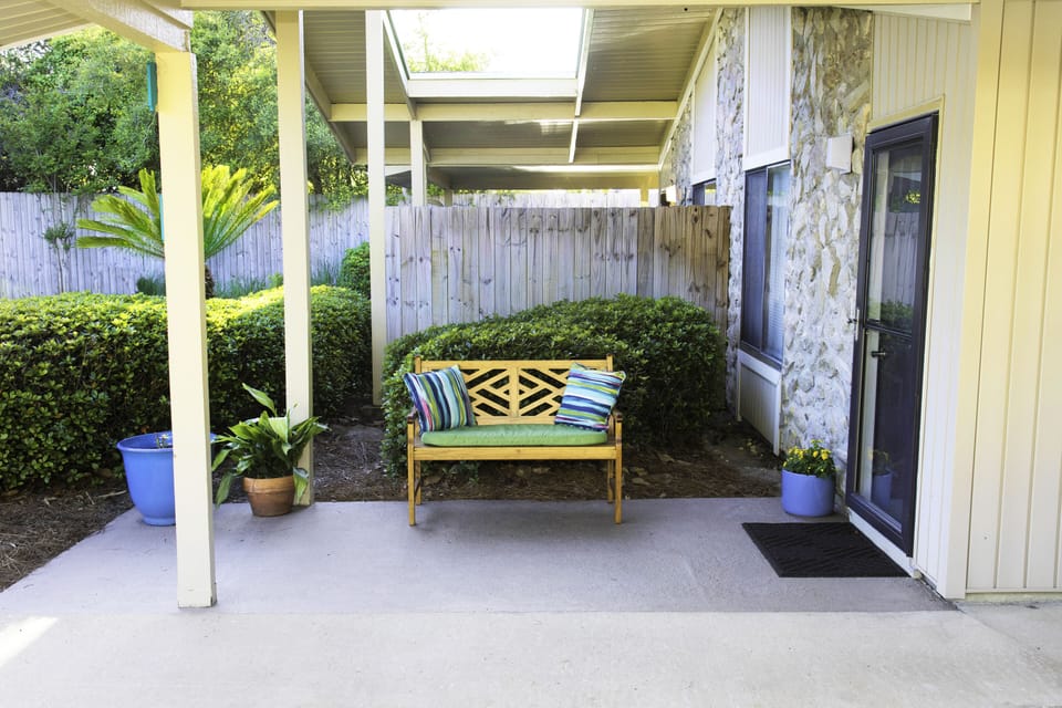 Sit and enjoy the relaxing feel of our porch and covered Carport. 