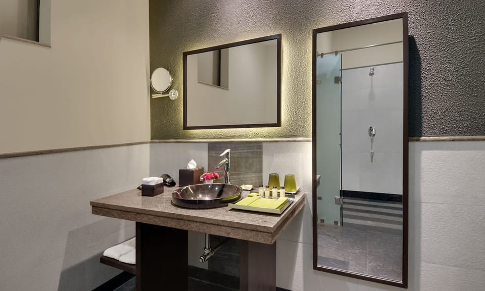 Shower, designer toiletries, hair dryer, bathrobes