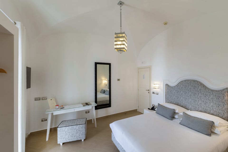 Superior Double Room, Terrace, Sea View | Minibar, in-room safe, desk, laptop workspace