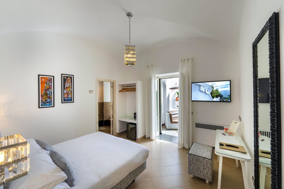 Superior Double Room, Terrace, Sea View | Minibar, in-room safe, desk, laptop workspace