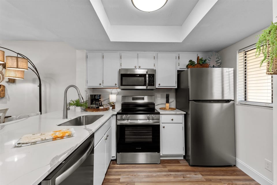 fully equipped kitchen with stainless steel appliances 