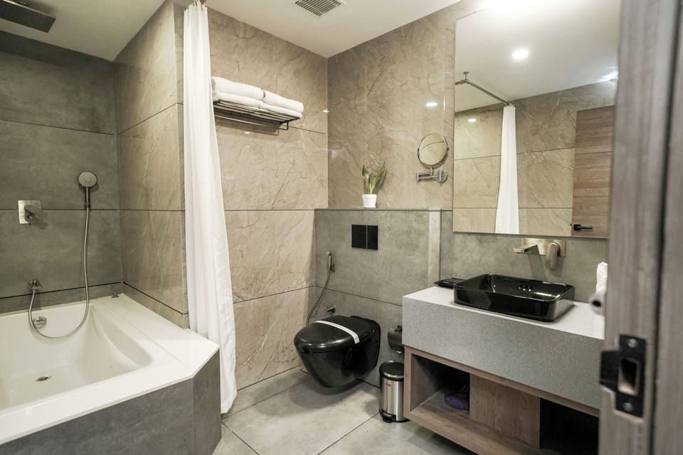 Royal Studio Suite, 1 King Bed, Balcony | Bathroom | Shower, rainfall showerhead, free toiletries, hair dryer