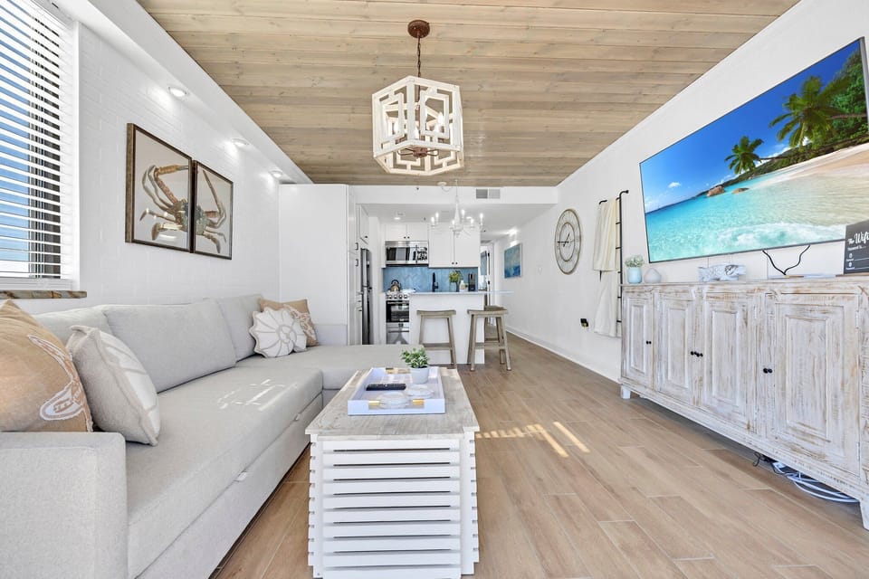 Great room is open to the adorable kitchen area.  SMART TV for all of your entertainment needs and we upgraded to the highest internet speed.  
