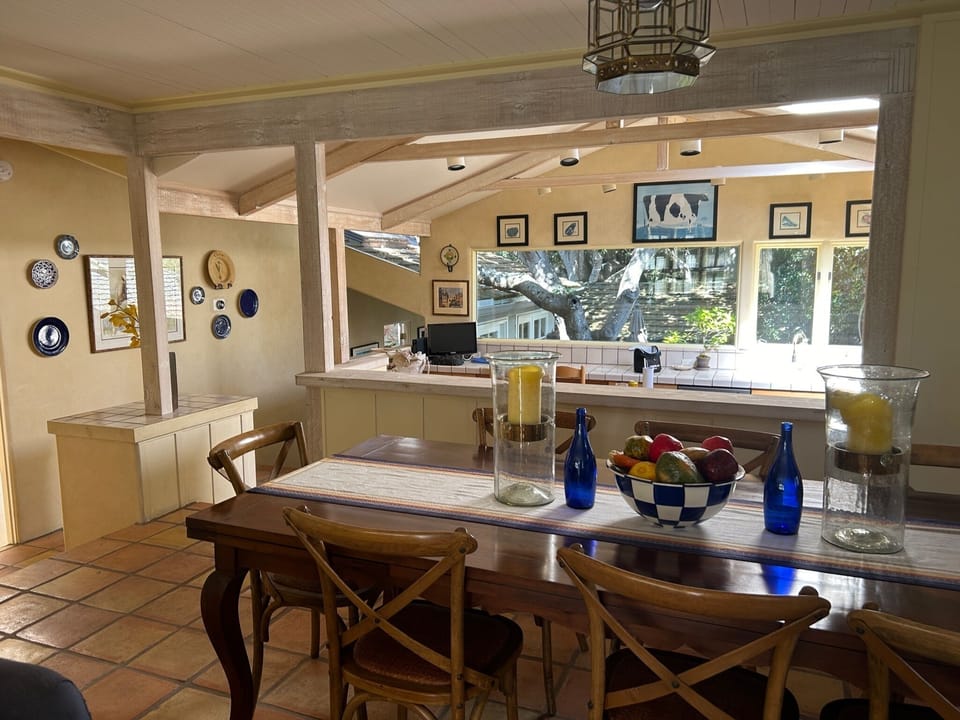 Dining room, conveniently located next to kitchen and features table for eight!