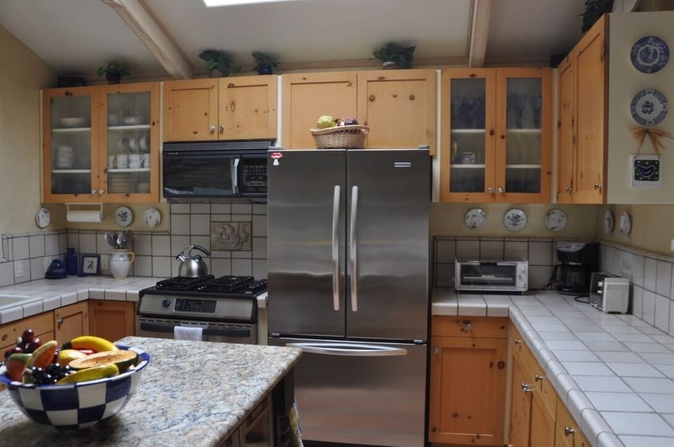 Kitchen, with modern appliances, bar area, island, and tons of natural light!
