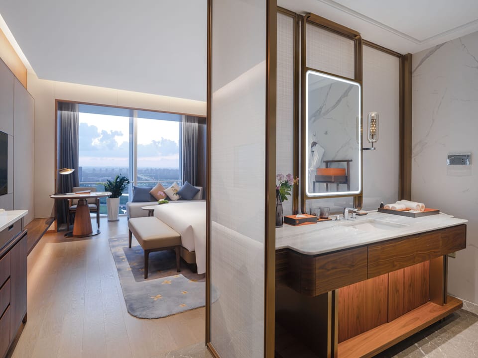 Deluxe Lake View King Room | Bathroom | Shower, rainfall showerhead, hair dryer, slippers