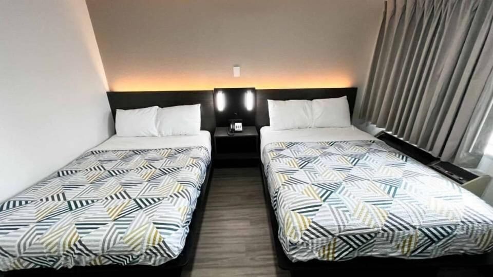 Desk, blackout drapes, WiFi (free), bed sheets