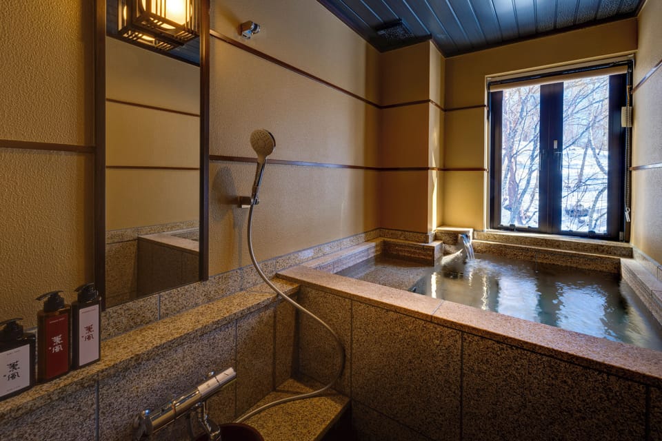 Combined shower/tub, deep soaking tub, slippers, towels