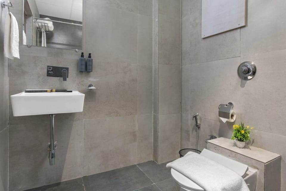 Shower, hair dryer, slippers, towels