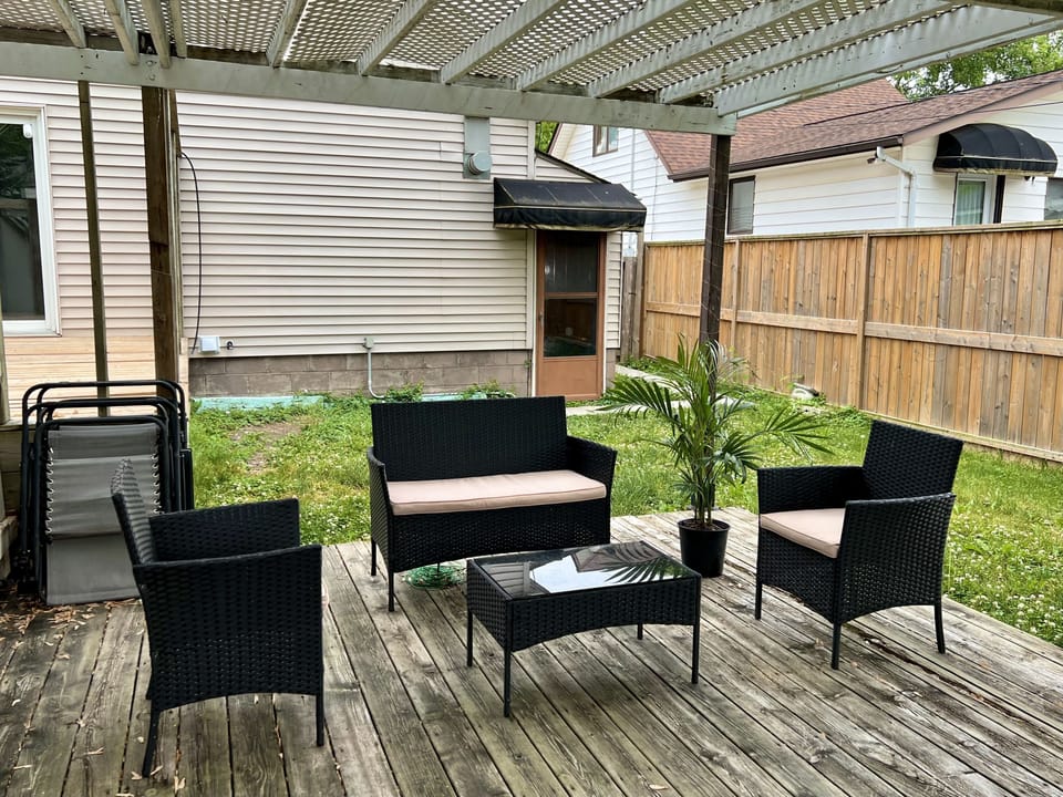 Outdoor sitting area. Entrance can be seen in the background. (Shared)