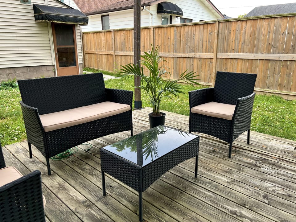 Outdoor sitting area. Entrance can be seen in the background. (Shared)