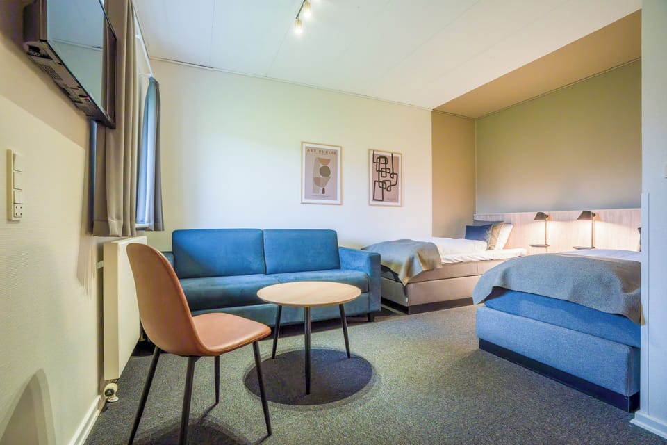 Comfort Quadruple Room, 1 King Bed with Sofa bed | Hypo-allergenic bedding, desk, iron/ironing board, cribs/infant beds