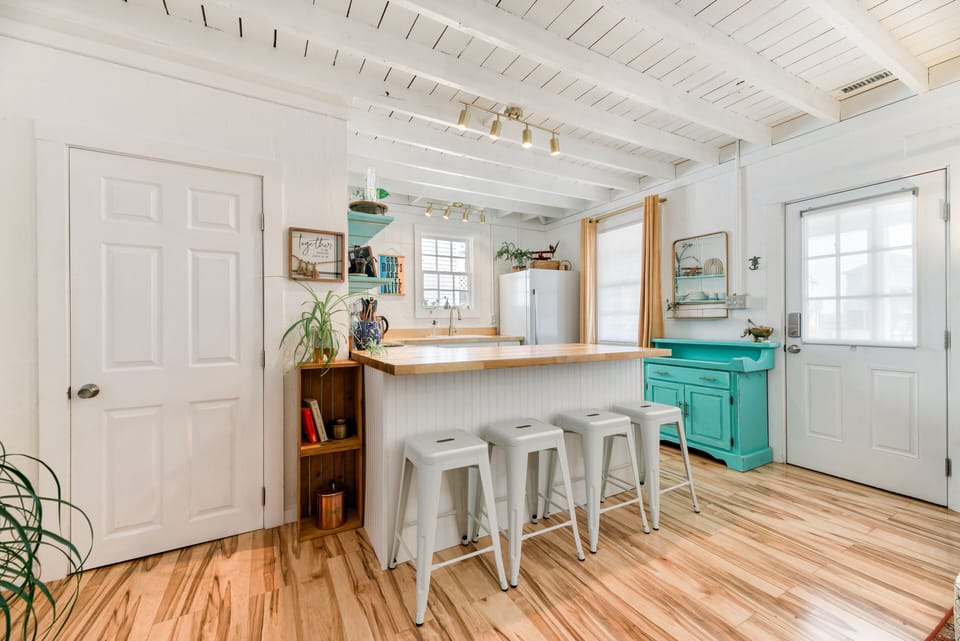 Kitchen - The glazed butcher block breakfast bar is a great place to catch a bite.