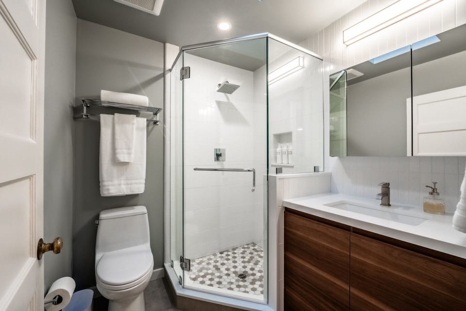 Guest bathroom offers a walk-in shower.