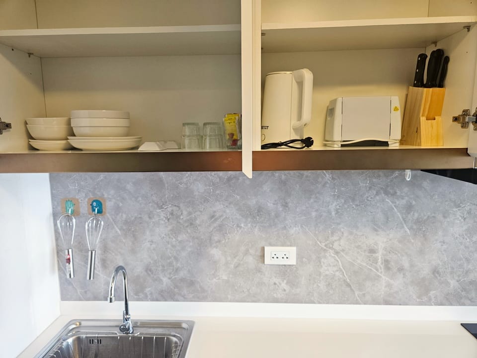 Apartment | Private kitchen | Full-size fridge, microwave, stovetop, coffee/tea maker