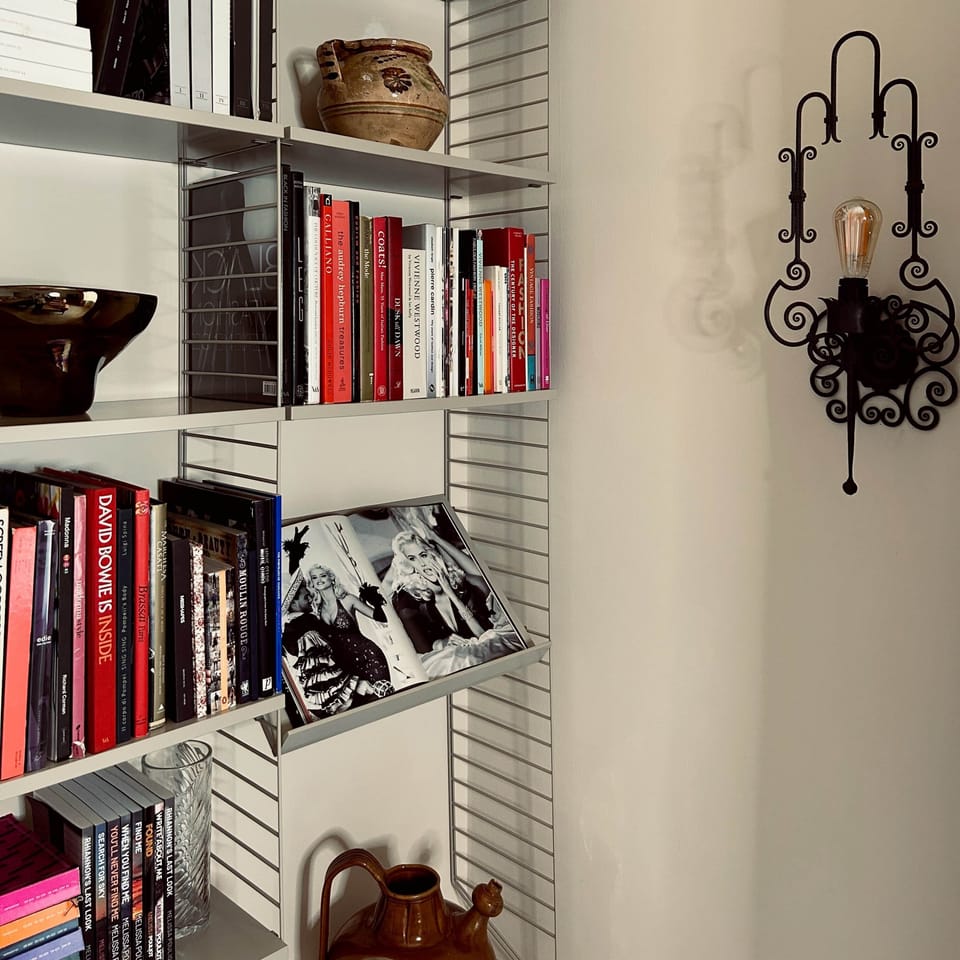 Enjoy art & design books amongst a display of local ceramics in the living room