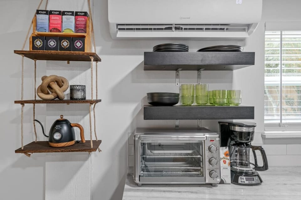 Our well-stocked kitchenette, complete with a variety of kitchenware essentials for your cooking needs.