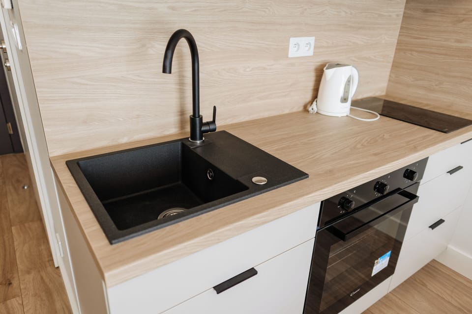 Fridge, stovetop, electric kettle, cookware/dishes/utensils