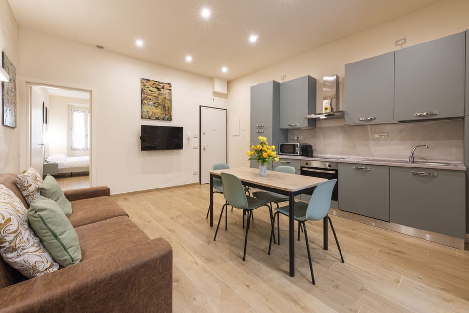 Deluxe Apartment | Living area | 40-inch flat-screen TV with digital channels
