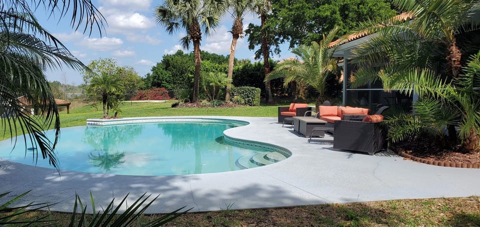 Sunset Cove pool, deck and comfortable outdoor seating