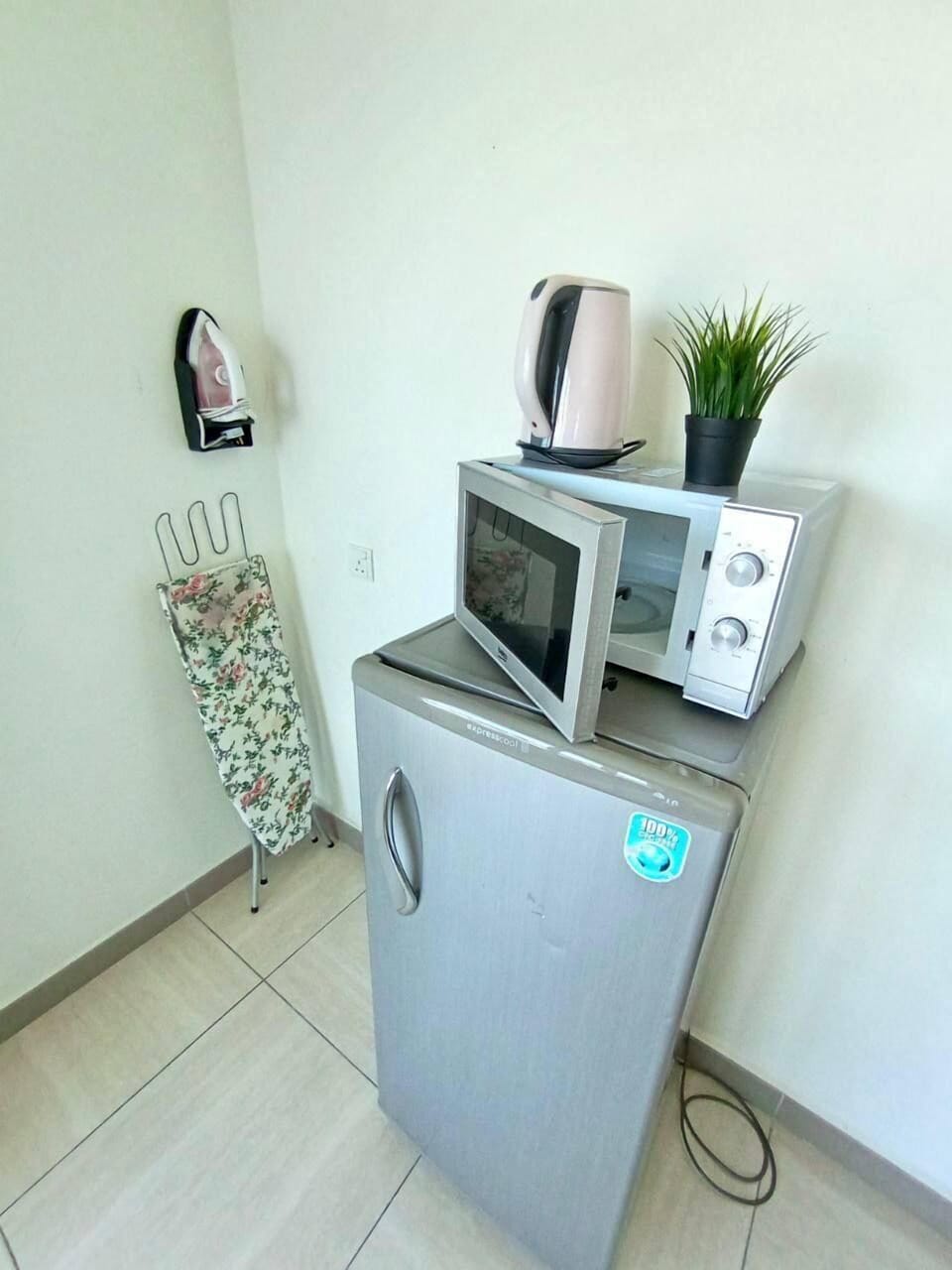 Apartment | Private kitchen | Electric kettle, dining tables