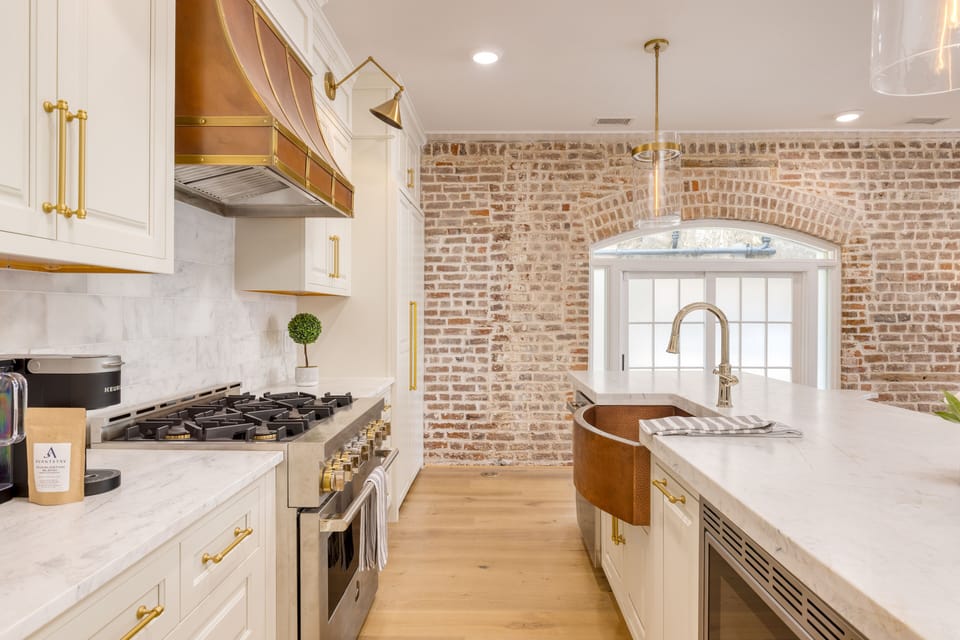 Chef's kitchen features stunning marble counters and high-end appliances.