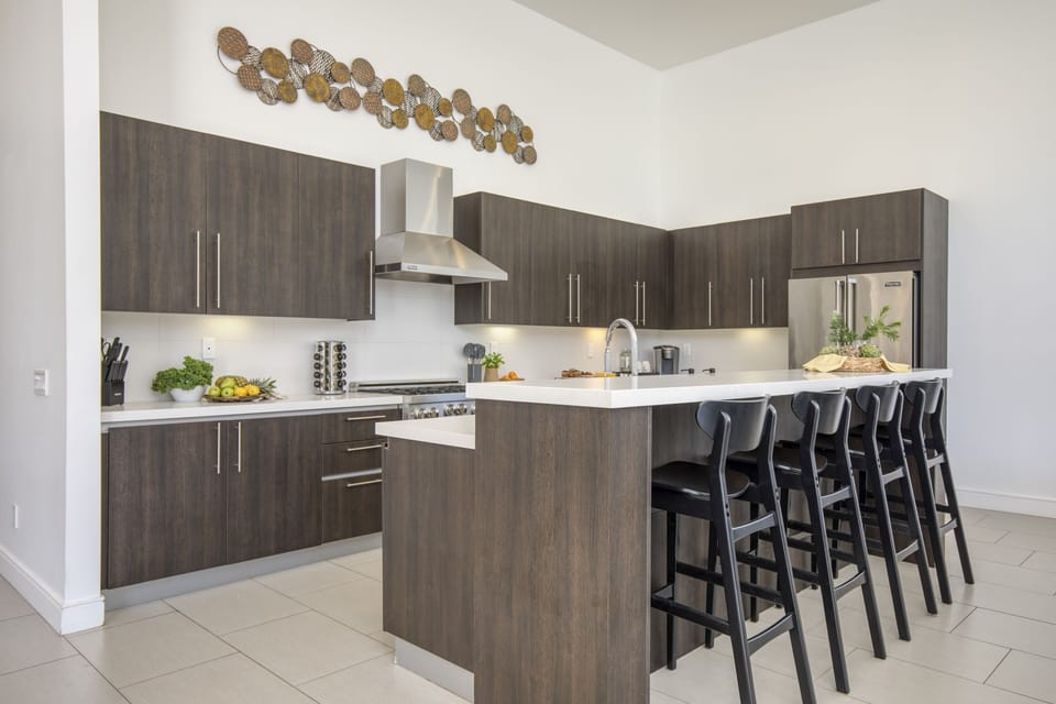 Chef's kitchen with barstool seating.