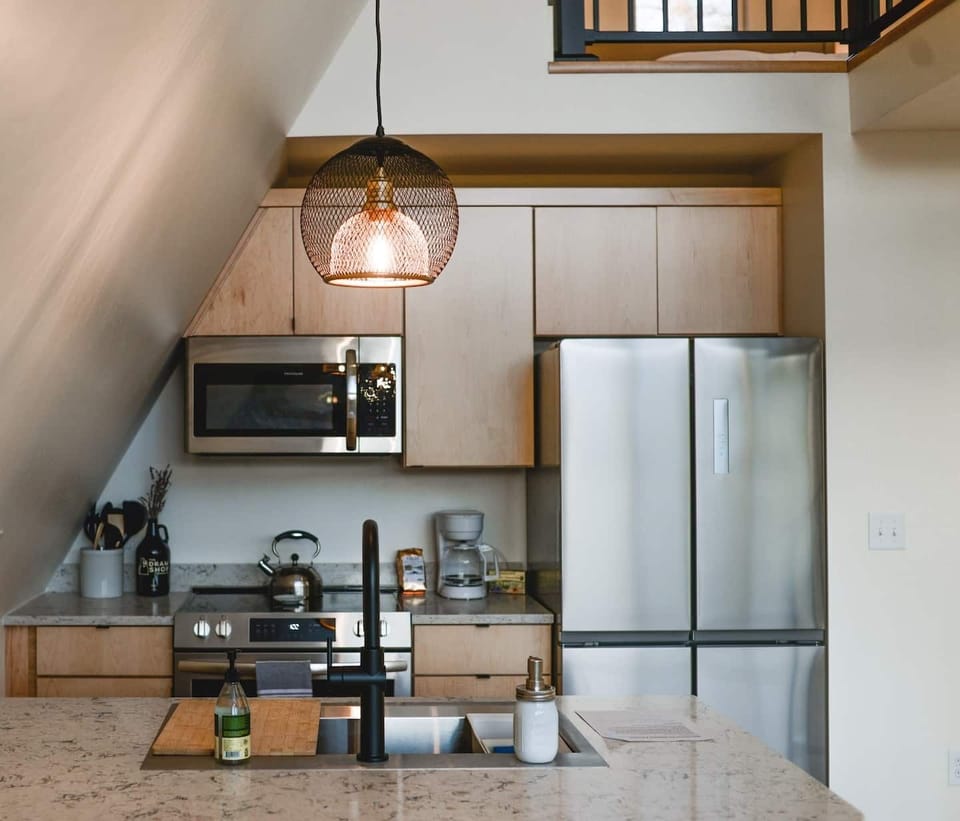view of the kitchen from bar stools.